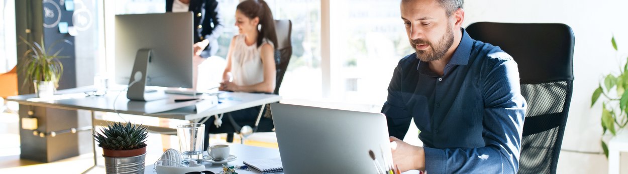 Business people using computers to view a sitemap.