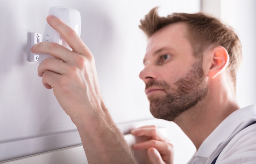 Melbourne technician onsite providing home security system services.